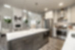This kitchen has updated conveniences with full tile backsplashes, modern cabinets and stainless appliances that represent the quality of builders coming to Dry Creek Estates