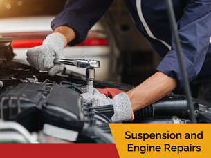 auto technician making repairs to an engine. Call Calridge for engine and suspension repair in Red Deer.