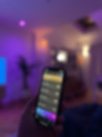 A phone being used to control smart lighting