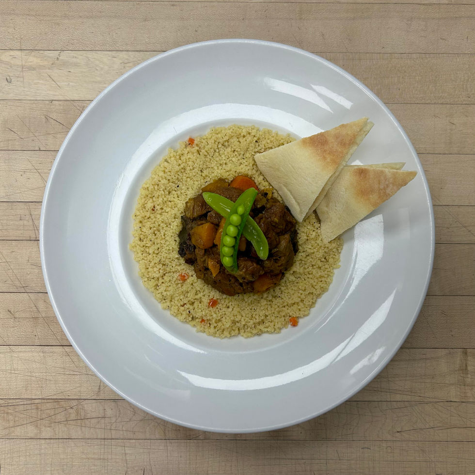 Moroccan Lamb Tagine
w/ Couscous & Pita Bread