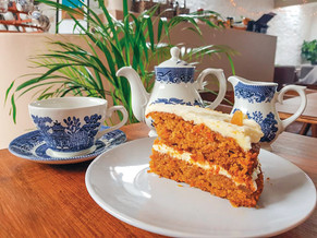 Cake and a pot of loose leaf tea.