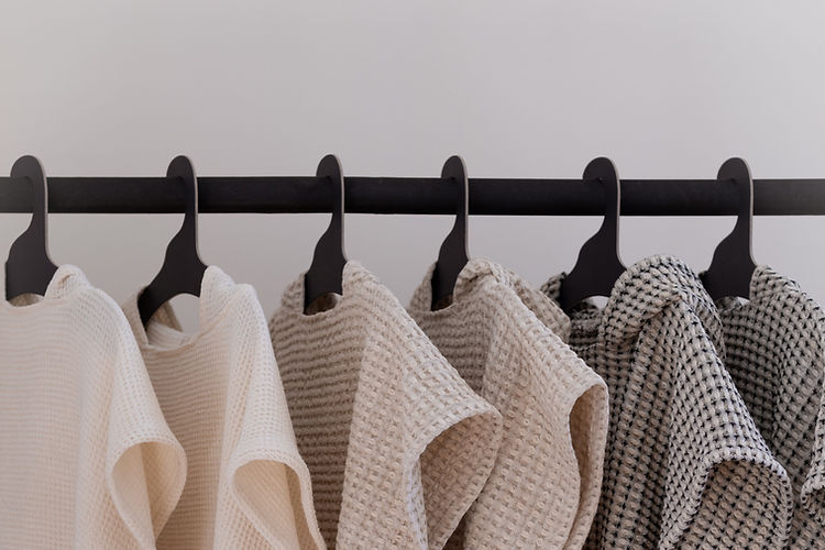 Cotton and linen ponchos with hood, beautifully hanged.