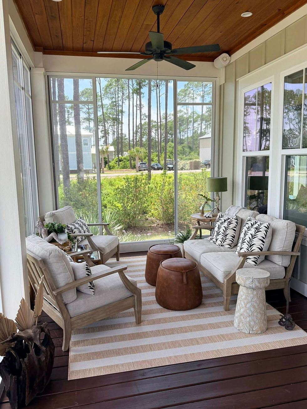 Eye-level view of a sunroom with large windows and natural light