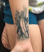 Feather airbrush tattoo