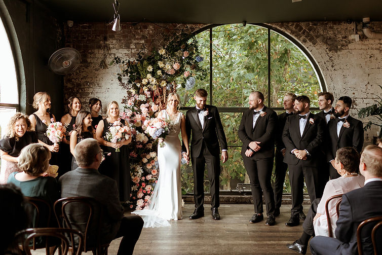 Joyful wedding ceremony at Panama Dining Room with Wendy Does Weddings. Photo taken by Nikki McCrone Photography