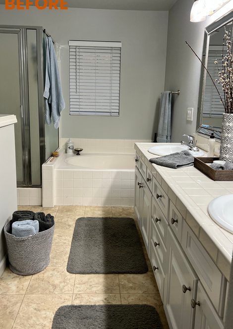 Before photo of a bathroom in Beaverton, showing outdated vanity, tile flooring, and glass shower enclosure – captured prior to bathroom remodeling by D.G. Ring Construction.