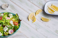 Fresh Salad with Lemon Wedges