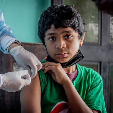young boy getting a shot