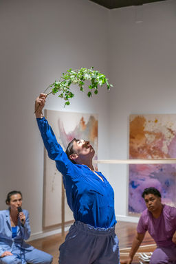 St. Pierre casts shadows on of leaves on her face while arching backward.