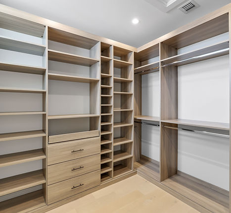 Walk in closet with custom shelving.jpg