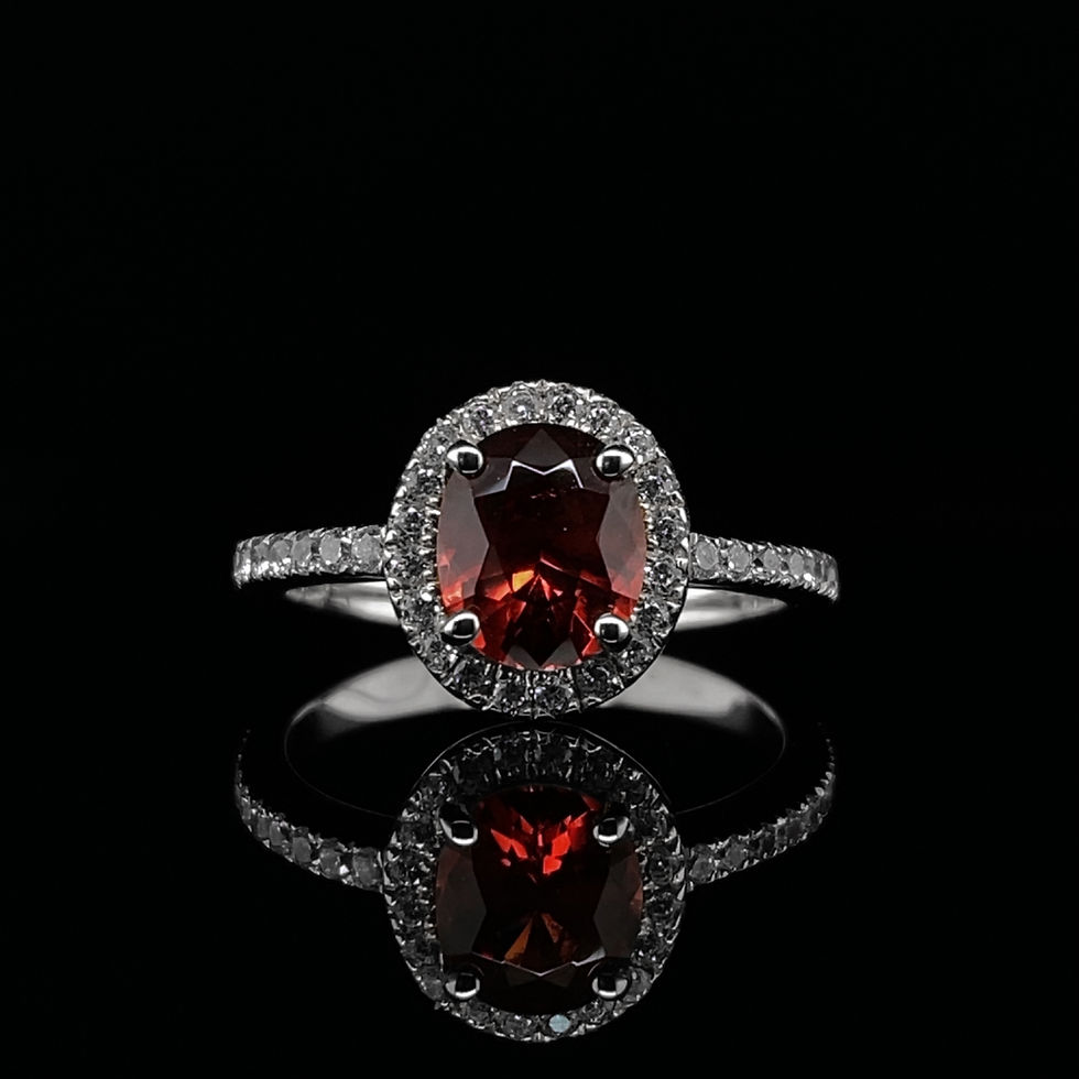 Oval Cut Orangey-Red Garnet and Cubic Zirconia Halo Engagement Ring in White Gold