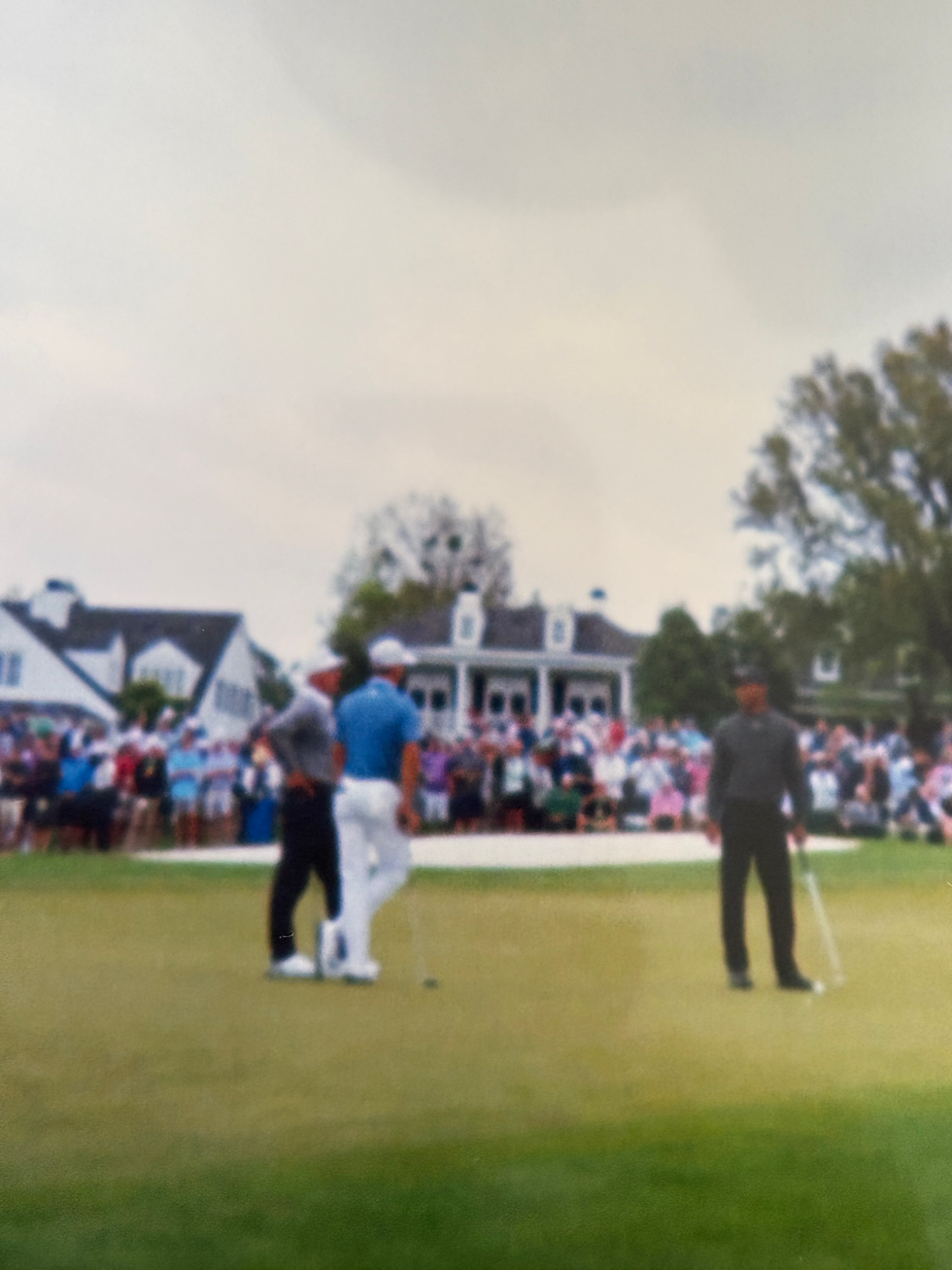 Fred Couples, Justin Thomas, Tiger Woods discussing shots during the practice round