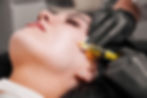 female-doctor-making-injection-woman-chin