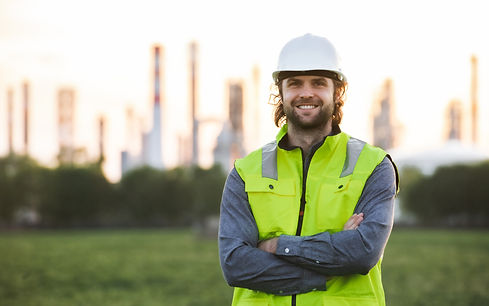 young-engineer-standing-outdoors-by-oil-refinery-2021-08-28-07-16-46-utc.jpg