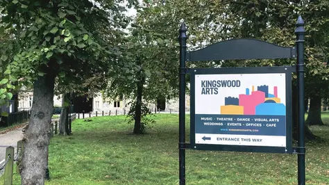 Signage design by Alex Makes for Kingswood Arts, displayed on metal sign post near Kingswood House