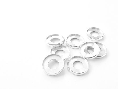 Aluminium binding discs on a white background