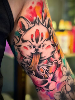 A Cute kitsune ramen tattoo created by Peel Tattoo Manchester
