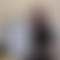 Smiling hairdresser holding finalist certificate for Best Hairdresser of the Year and Best New Salon of the Year 2025 at the Hair and Beauty Awards.