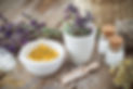 Mortar and bowl of dried healing herbs a