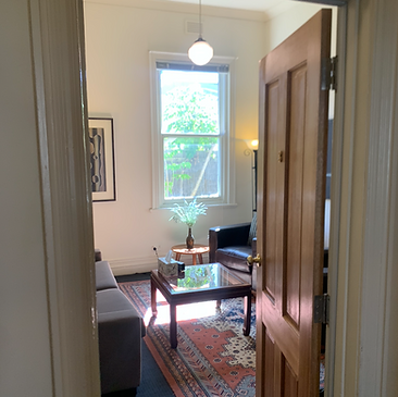 A view through a door of a room used for therapy at Melbourne Psychology House'