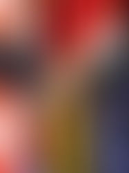 Two people in suits shaking hands in front of international flags, symbolizing diplomacy. Flags include red, white, and blue colors.