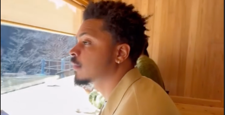 Tacai staring through window