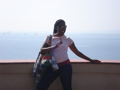 Danielle standing in front of water