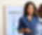 Hearth display product hanging on a wall with a woman standing in front of it