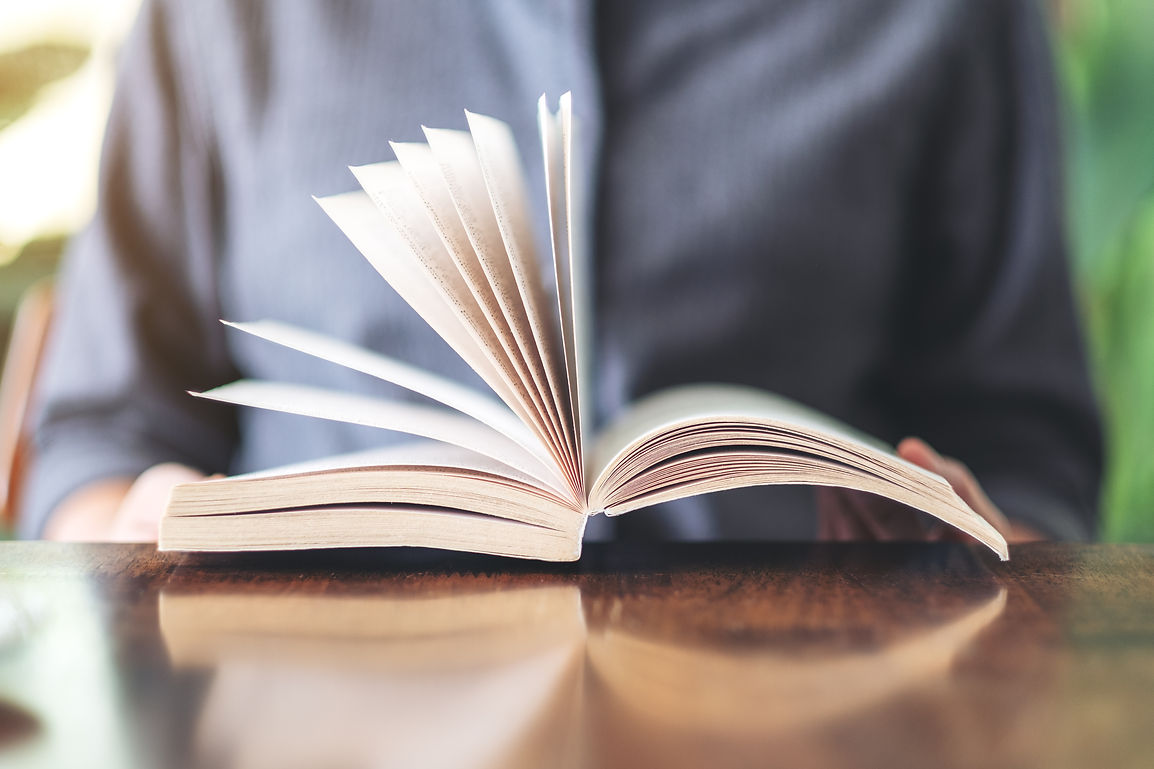 closeup-image-of-a-woman-holding-and-reading-a-vin-2024-11-27-15-45-55-utc.jpg