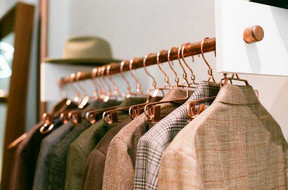 various-types-of-suits-hanging-on-a-suit-hanger.jpeg