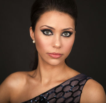 Beautiful headshot of a young woman on a night dress.