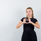 young-lady-showing-heart-gesture-t-shirt-pants-looking-cute-front-view.jpg