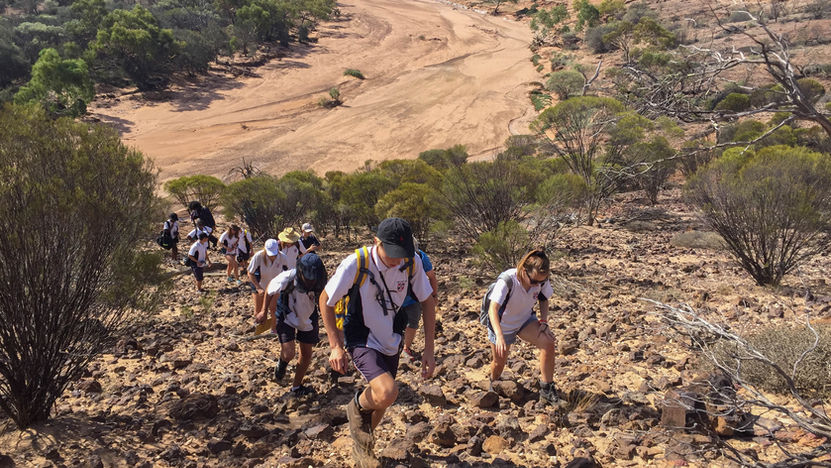 Students Climbing On Mountains Students exploring river valleys