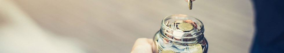 Pennies charity donation jar on forecourt shop counter – encouraging micro-donations to support UK causes