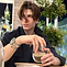 Kareem Shami outdoors holding a drink, casual look suggesting lifestyle or personal brand image