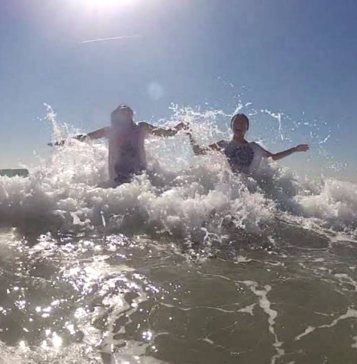 Emily and Kelly playing in the surf