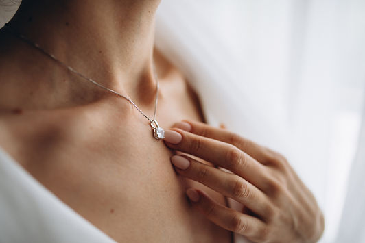 woman-wearing-shiny-diamond-pendant.jpg
