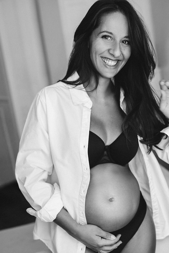 "Sharmilee smiling during a maternity photography session in New York City"