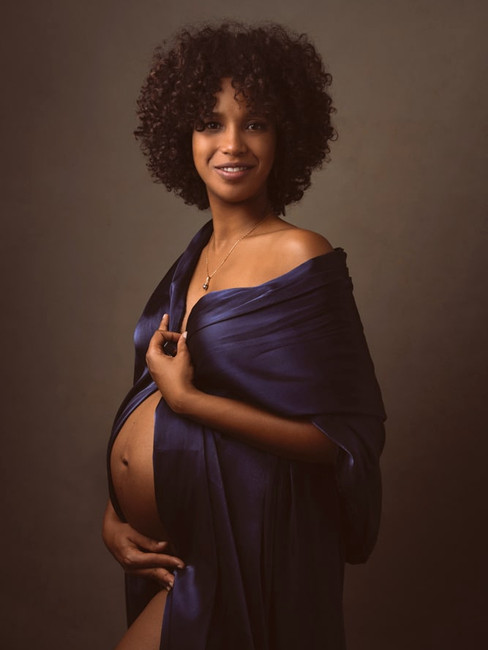 Elegant maternity portrait of an expecting mother photographed in New York City during a Chic maternity experience.