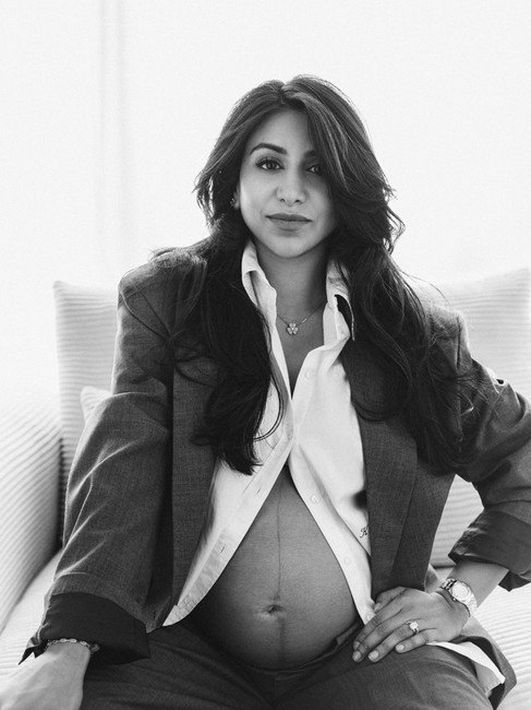 Editorial maternity portrait of an expecting mother in a tailored suit photographed by Alice Prenat in New York City.