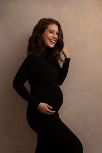Elegant maternity photography session in NYC with soft studio lighting