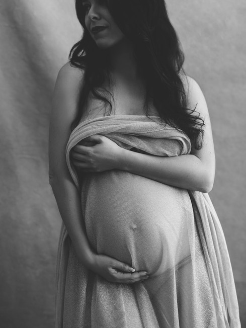 Studio maternity photography portrait using flowing maternity wraps during a Chic maternity experience in NYC.