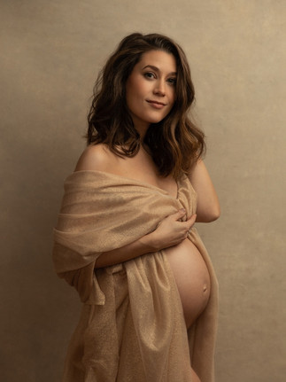 High-end maternity photoshoot in New York City featuring a poised expectant mother