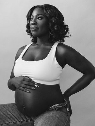 Elegant maternity photography portrait of an expecting mother during the Chic Maternity Experience in New York City.