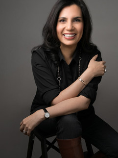 professional headshot of a female author smiling at the camera for her book cover taken in NYC top portrait studio 