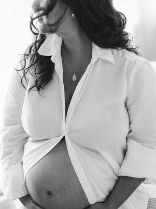 Elegant studio maternity portrait celebrating pregnancy during a Portrait Madame Chic Maternity session in New York City.