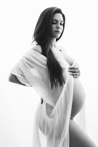 Maternity posing ideas silhouette in NYC photo studio
