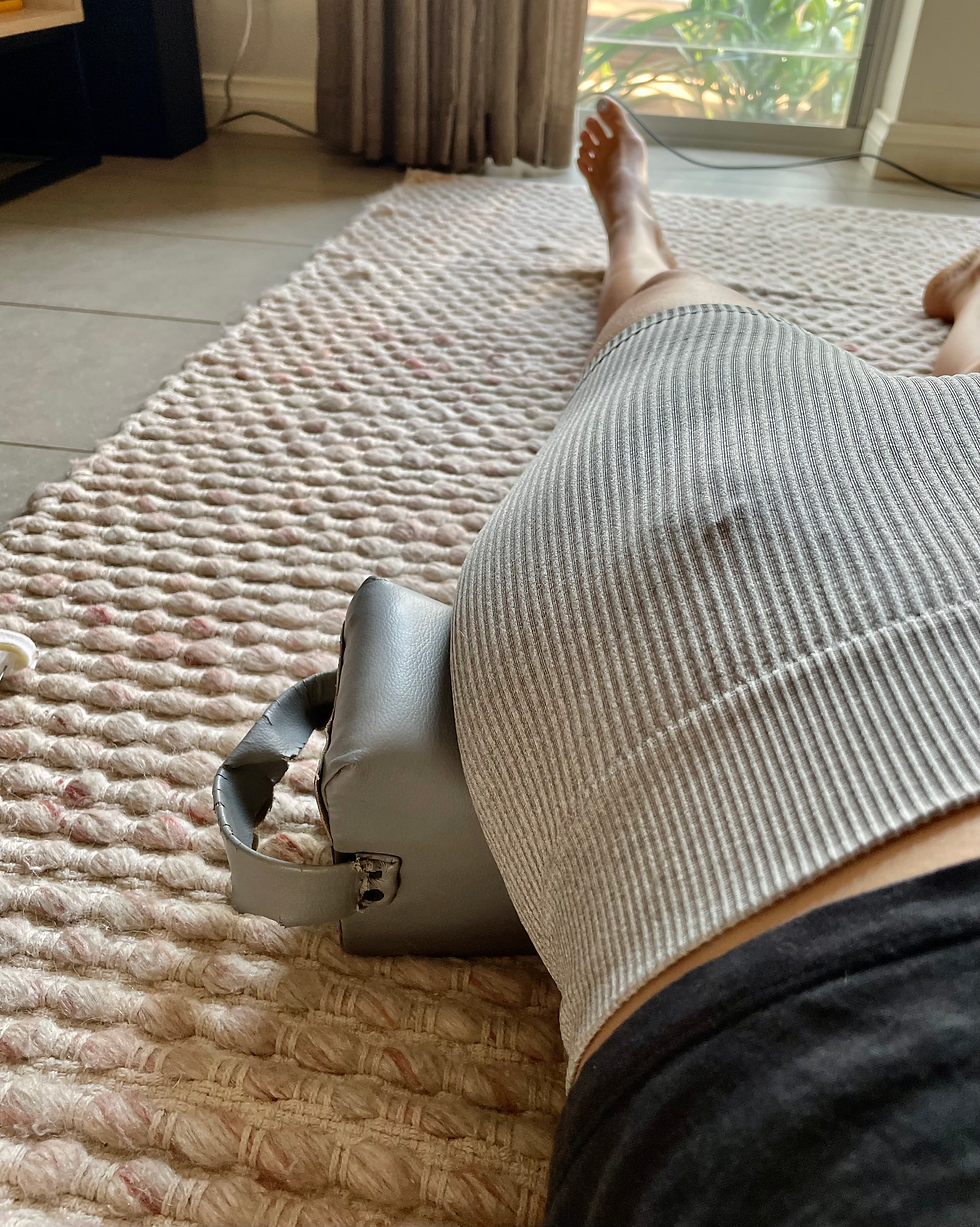 Dr Steph from Cable Beach Chiropractic using chiropractic blocks for her low back pain