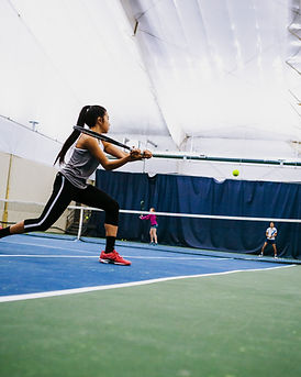 Teen girls playing tennis at Club CDL