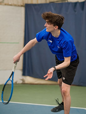 Teen boy playing tennis at Club CDL